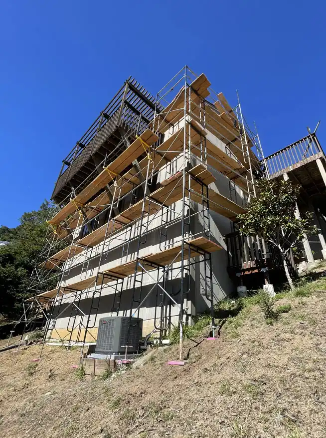 Hillside residential scaffolding setup by OC Elite Scaffolding for multi-level exterior work