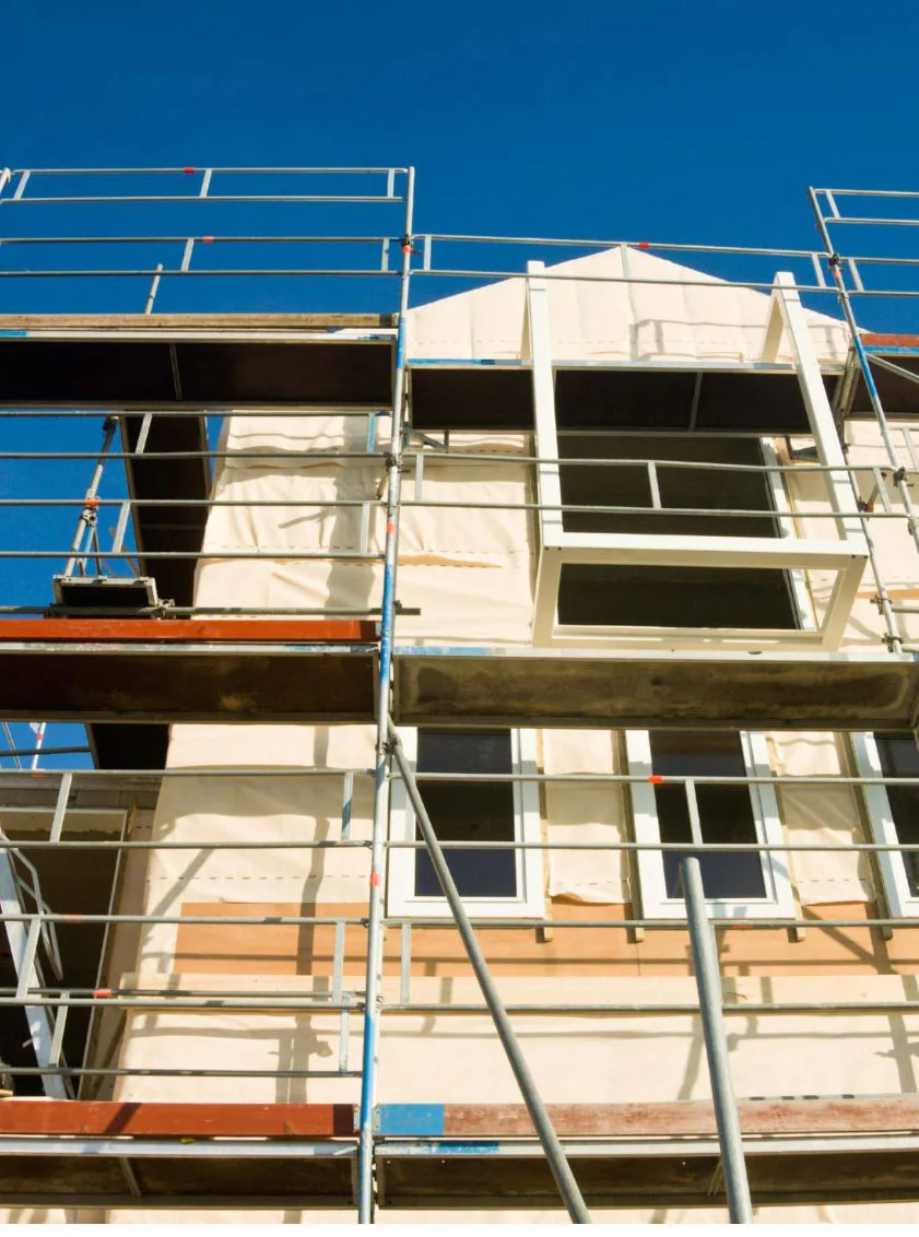 New construction scaffolding installed by OC Elite Scaffolding for exterior wall and window work